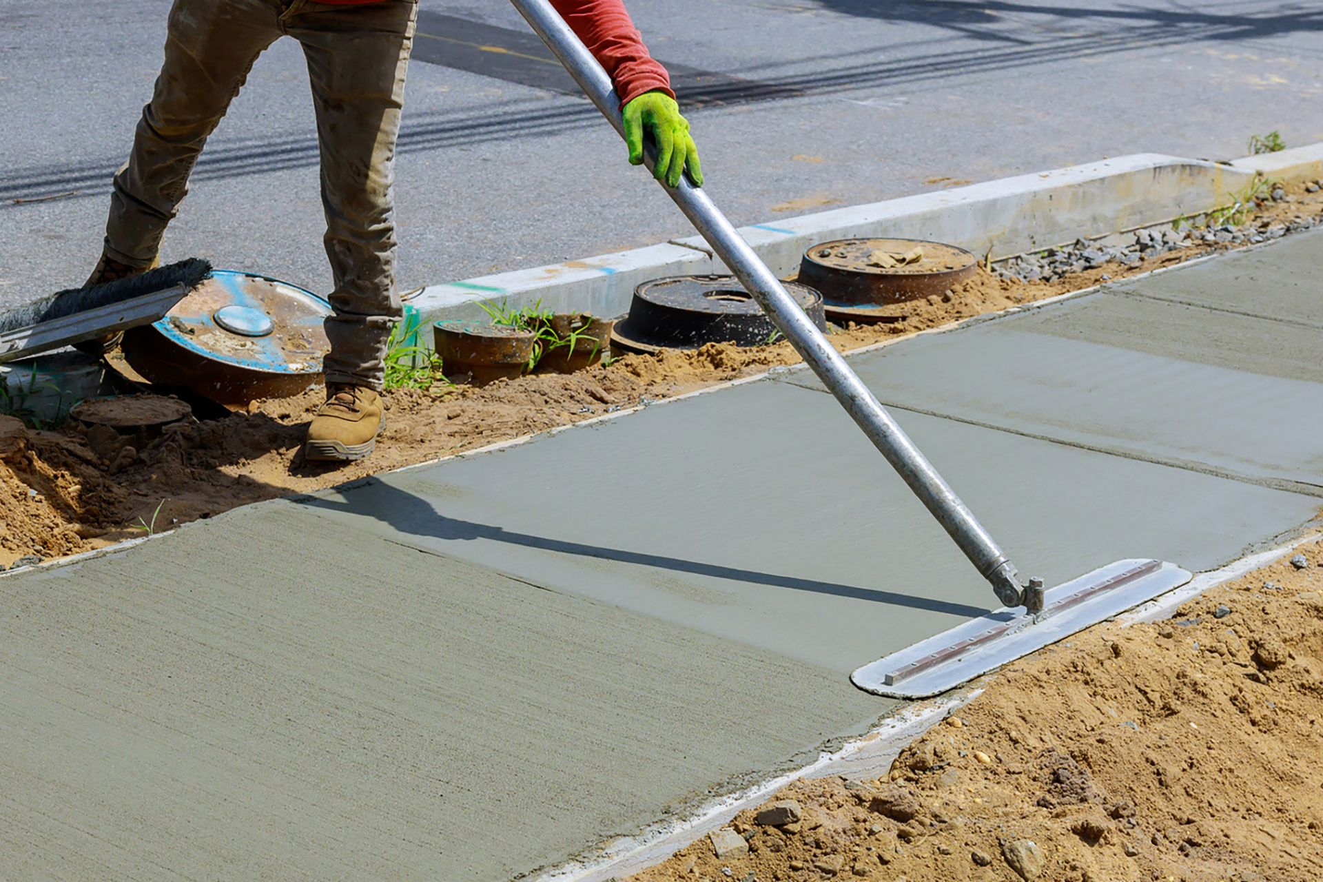 Laying,Down,New,Sidewalk,In,Wet,Concrete,On,Freshly,Poured